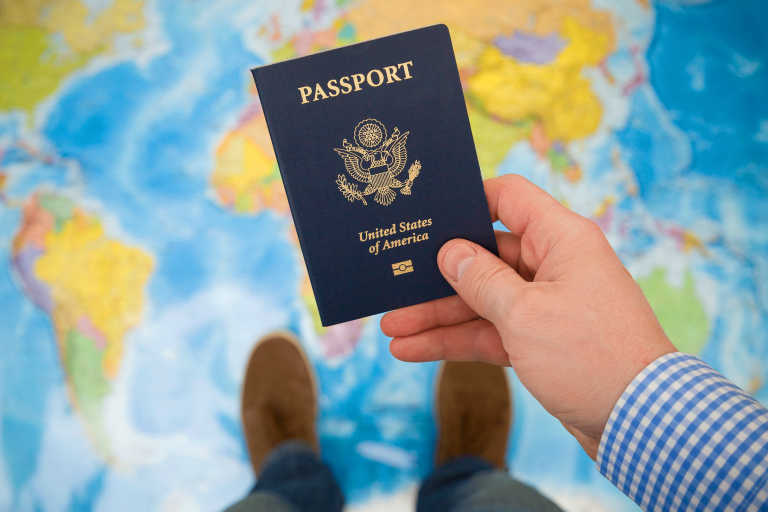 generic-us-passport-in-hand-travel-map generic-us-passport-in-hand-travel-map