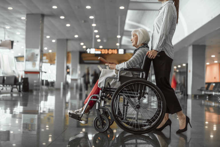 woman-wheelchair-airport