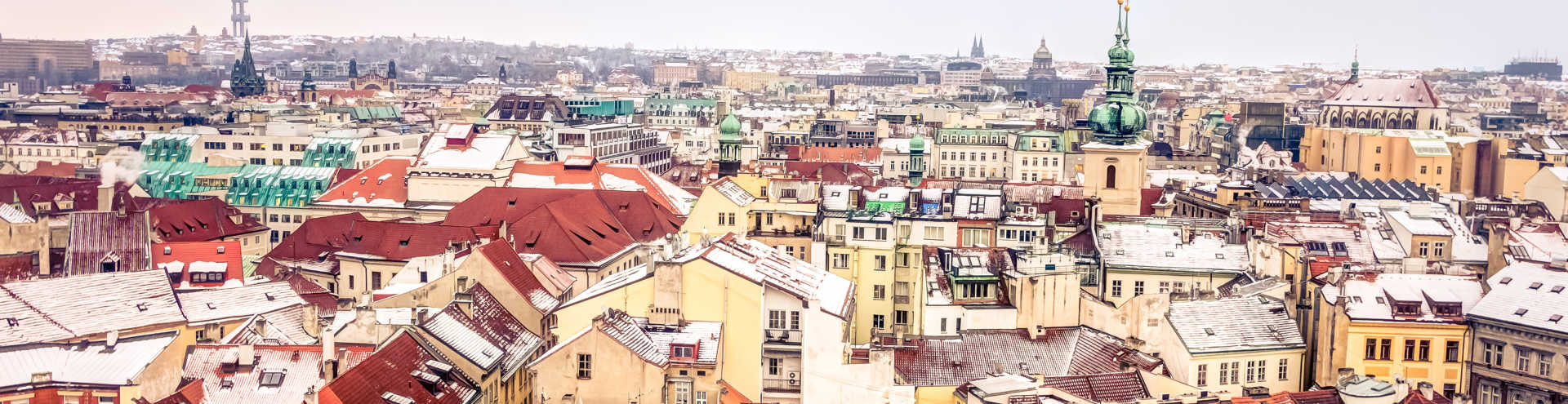 https://s1.travix.com/eu/europe-czech-prague-view-city-snow-rooftops-xlarge.jpg