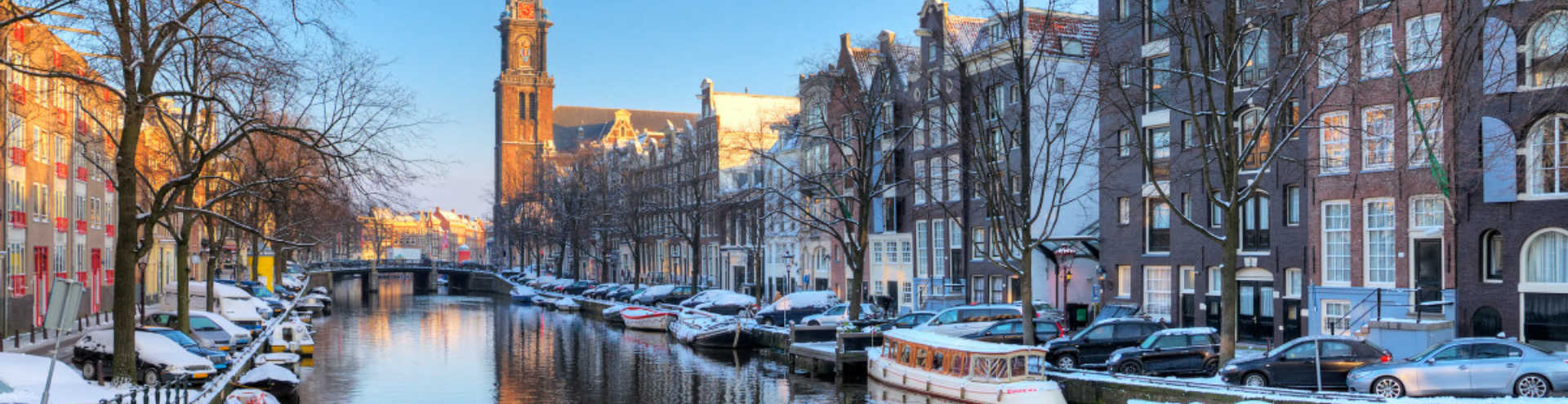 https://s1.travix.com/eu/europe-netherlands-amsterdam-canals-winter-xlarge.jpg