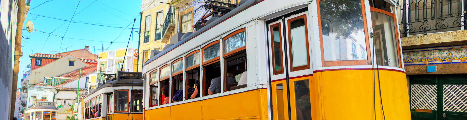 https://s1.travix.com/eu/europe-portugal-lisbon-trams-in-alley-xlarge.jpg