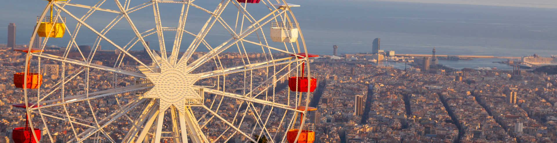 //s1.travix.com/eu/europe-spain-barcelona-ferris-wheel-xlarge.jpg