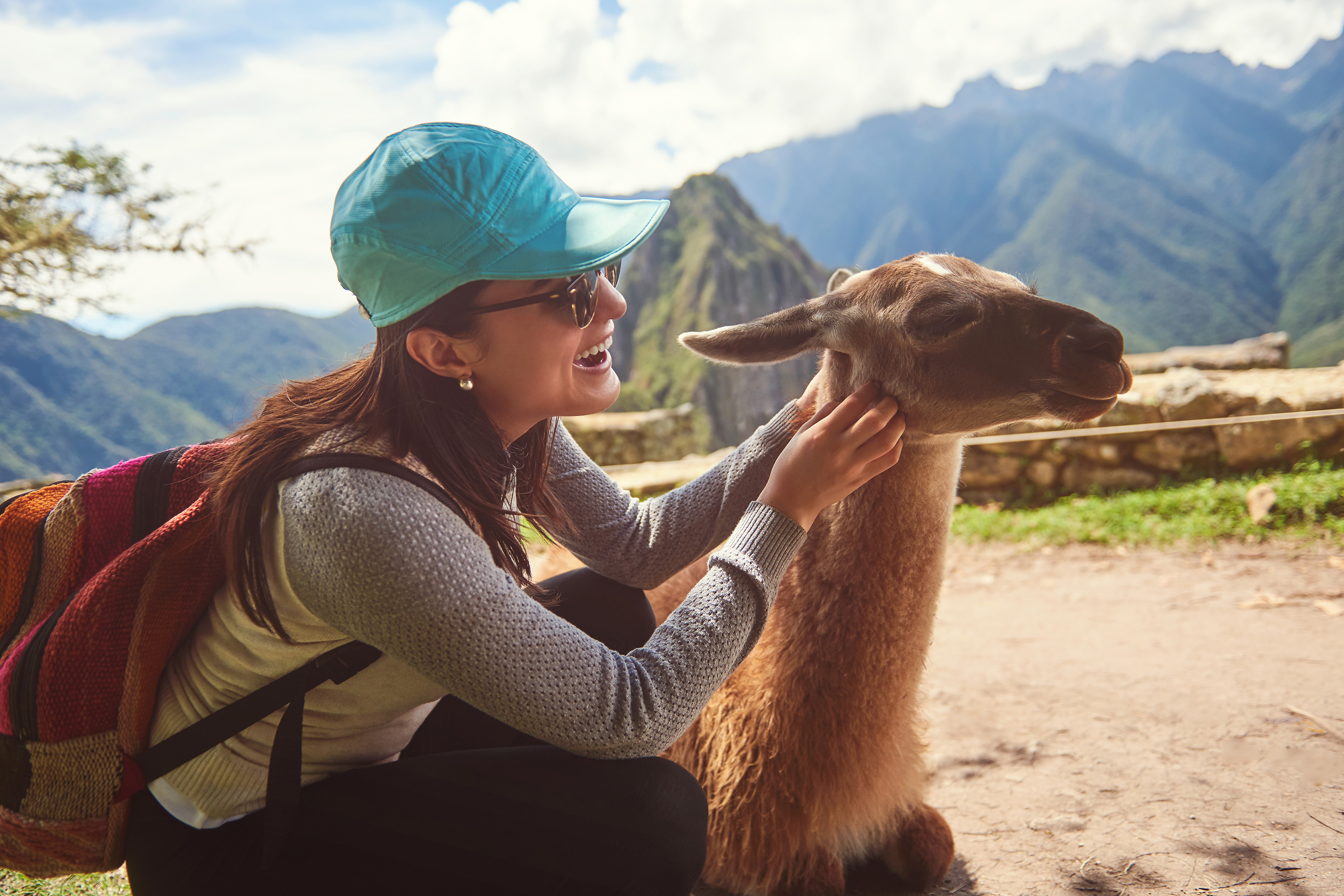 https://s1.travix.com/images/south-america-peru-cusco-alpaca-girl-tourism.jpg